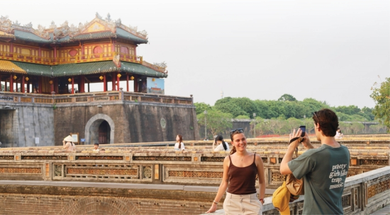 Visitors posing for photos in front of the Imperial Citadel
